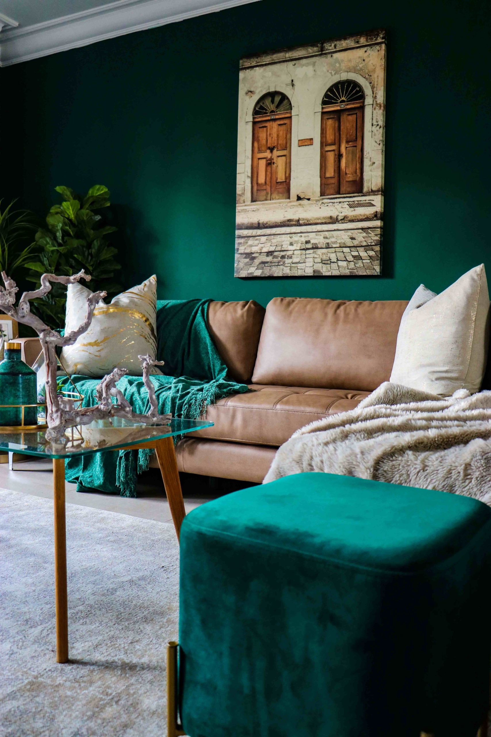 bold green cozy living room with plush pillows and fuzzy throws