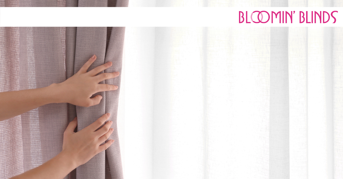 hands pulling back curtains