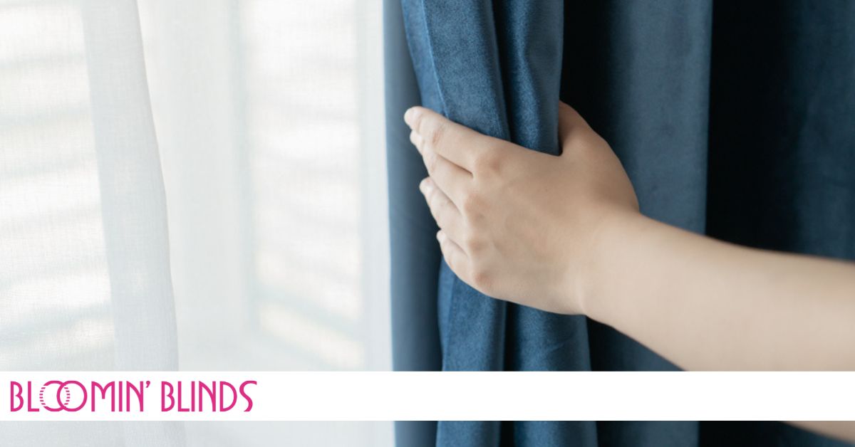 hand pulling back curtains