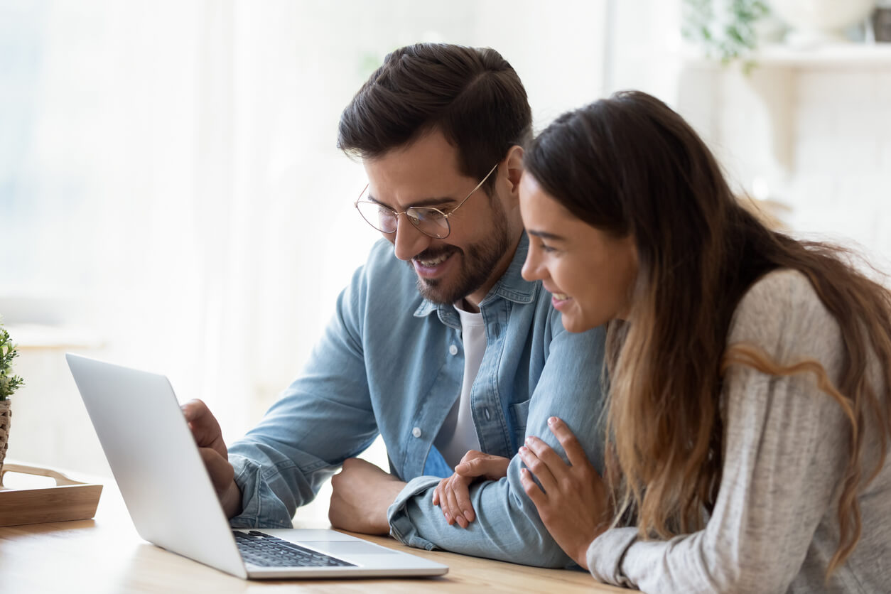 Man and woman using computer