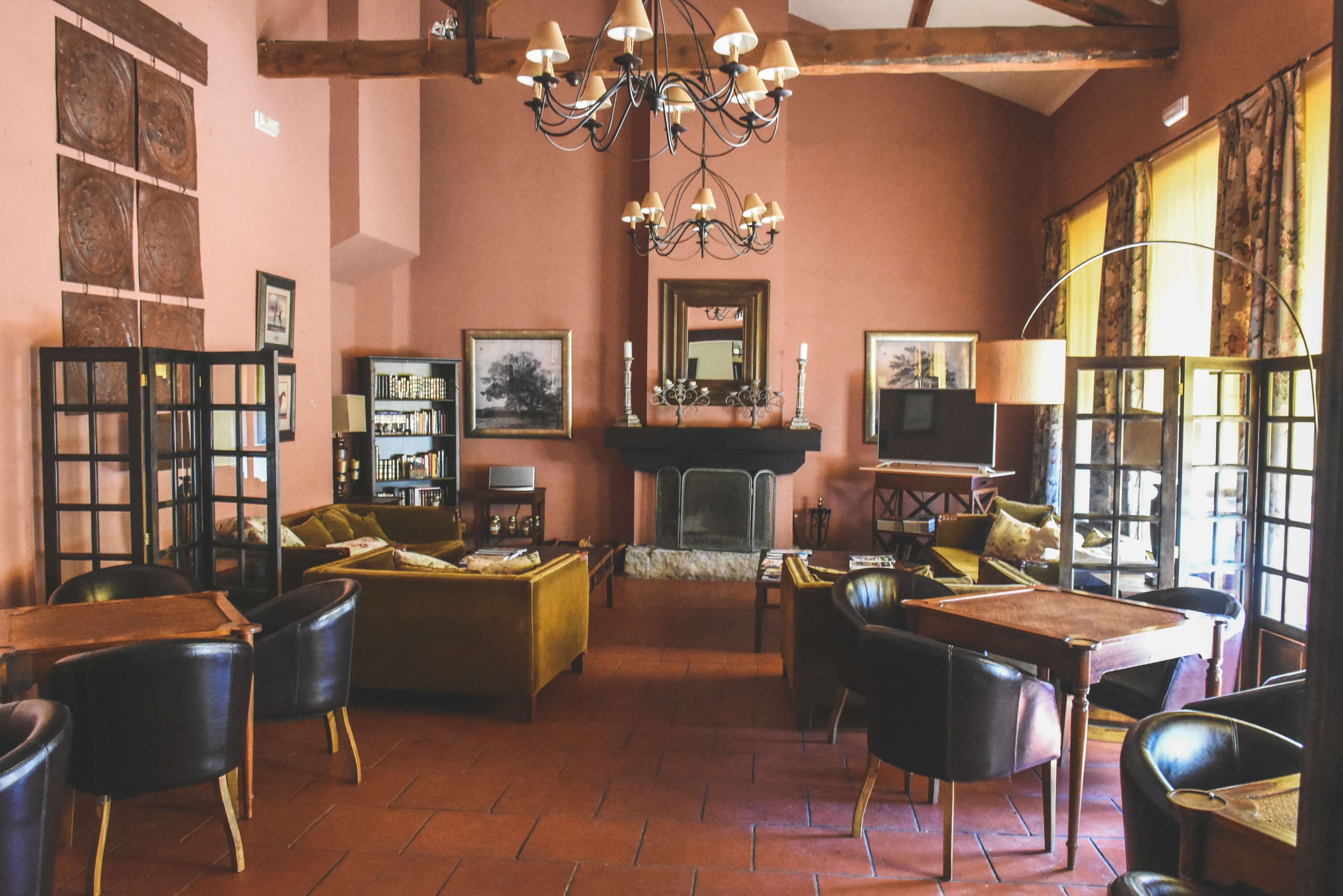 large cozy living room with seating away from the walls