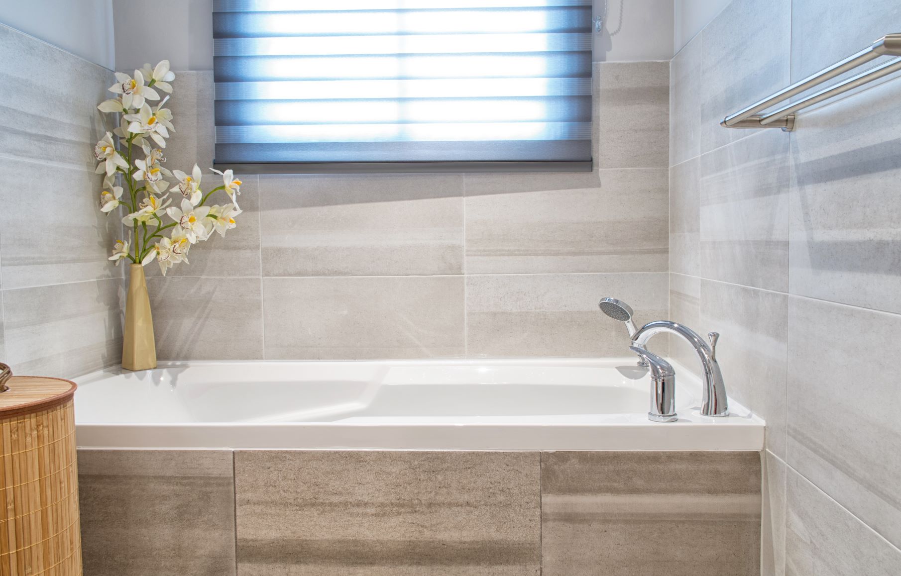 zebra blinds in a bathroom over the tub